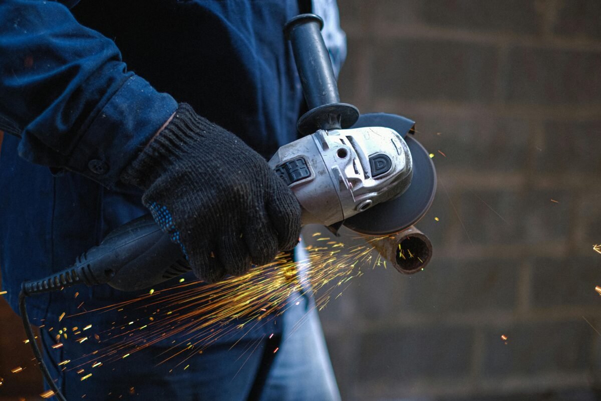 man working with a grinder